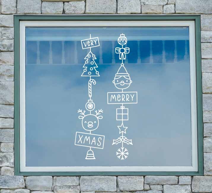 Vinil navideño con torres decorativas que incluyen a Santa, renos, árboles, regalos, bastones de caramelo y ornamentos.